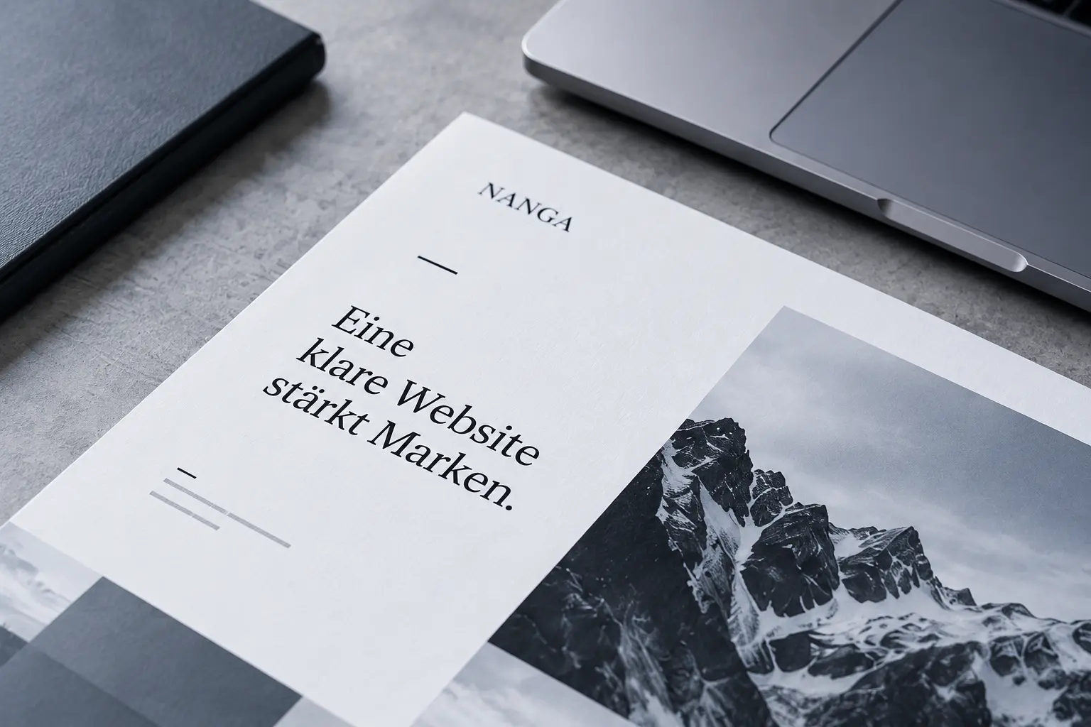 Printed NANGA document titled “A clear website strengthens brands” next to a laptop